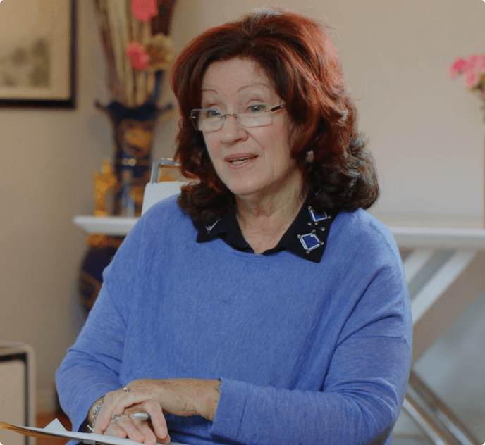 Sue Johnson sitting and talking