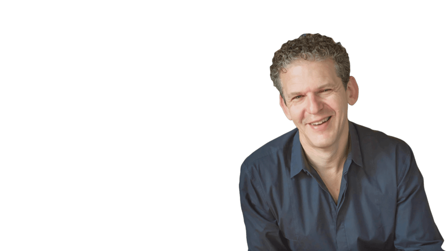 Russ Harris smiling at the camera