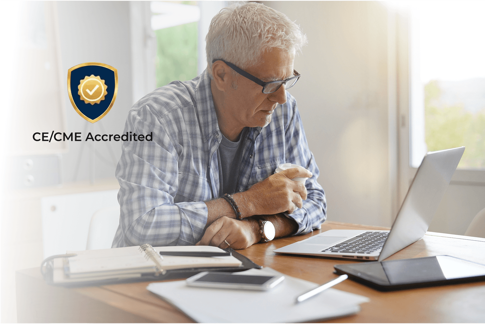 Man at a computer with a CE Badge
